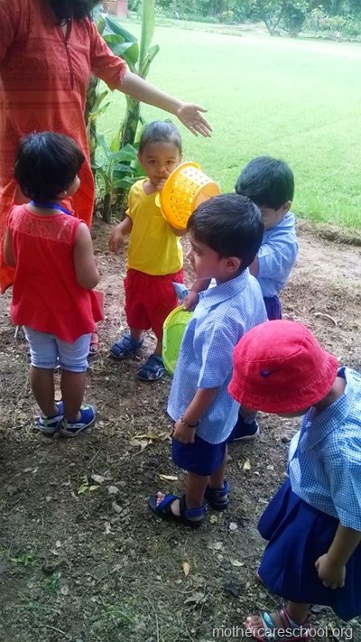 children planting neem seeds at nursery school (8)
