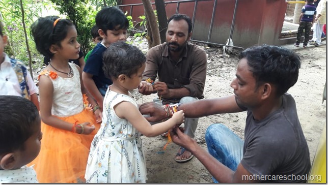 Playgroup children  learning about gratitude to those who nurture and care for us like the teachers, ayahs, van bhayiyas, trees and plants and Moolchand mali bhaiya by tying rakhis (2)